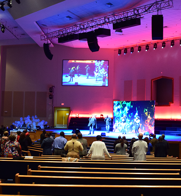 Image of a church with MCC audio visual solutions installed including lighting and sound systems, projectors and screens and video production.