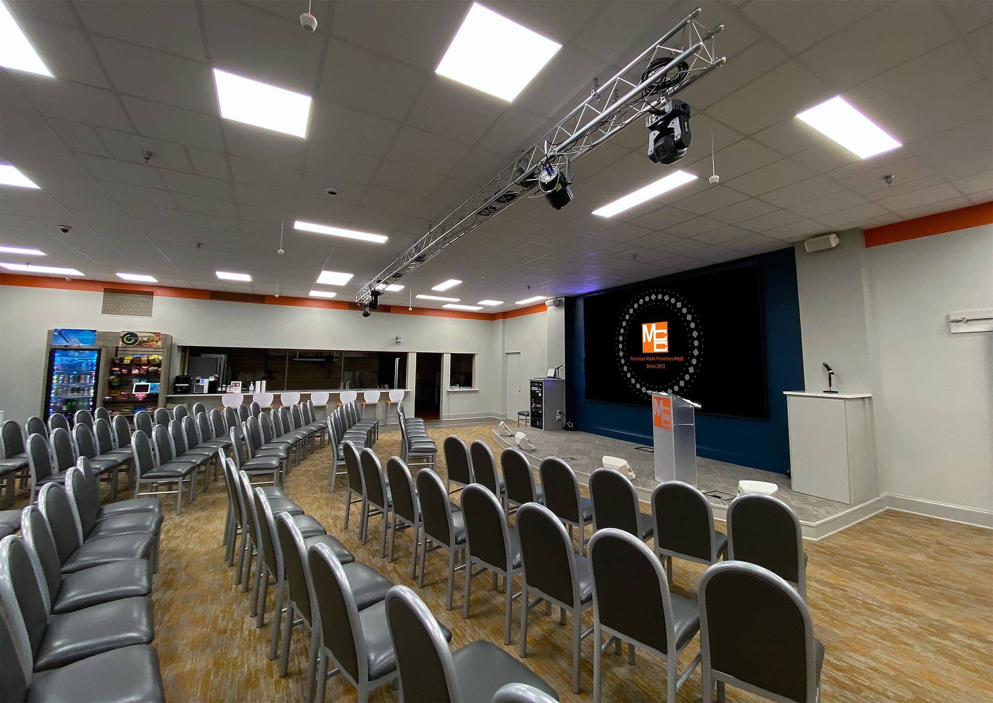 MCC University, the central gathering point at MCC Memphis, features a massive LED wall, digital signage, Webex Room Kit Pro video conferencing and custom lighting and sound systems with smart controls.