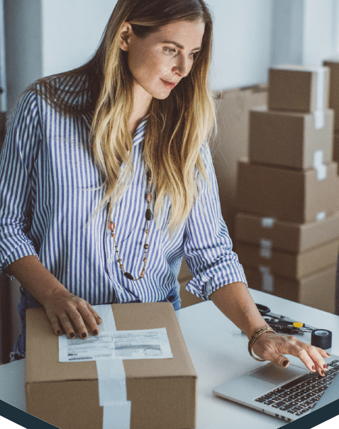 Business woman shipping packages using mcc office technology solutions and mailing and shipping software