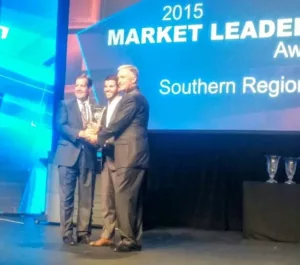 About MCC - Awards - Shane Berry and Brian Berry receiving the 2015 Toshiba Southern Region Dealer of the Year award.