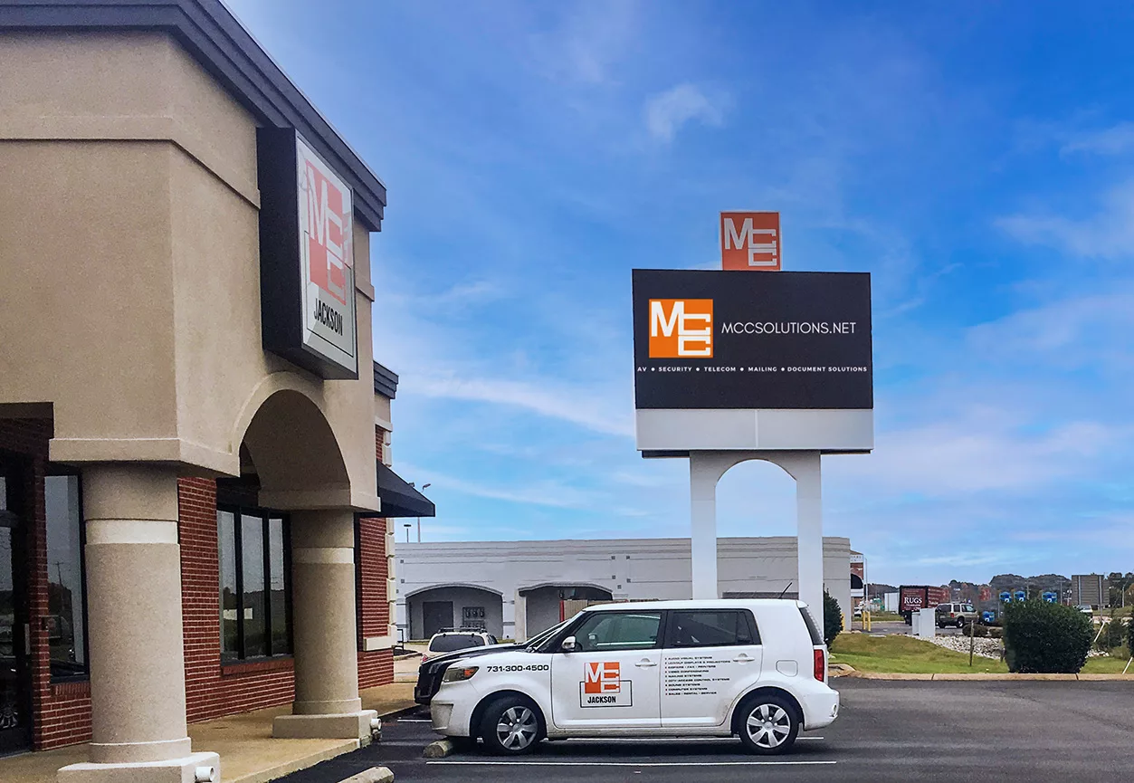 MCC Jackson office in Jackson, TN with an MCC vehicle parked outside and the MCC digital LED billboard